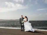 couple enjoying ayrshire wedding package on beach