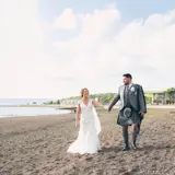 couple on the beach during wedding day at brisbane house wedding venue largs