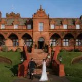 Couple walking toward Boclair House Hotel