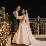couple embracing for photoshoot after micro wedding in scotland