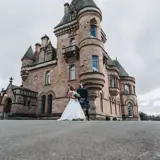 Couple standing infront of castle