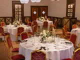 tables and plate settings for a wedding evening meal at boclair house