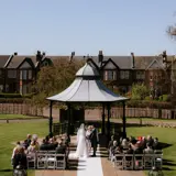 Couple getting married outside at Boclair House
