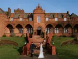 Couple walking towards Boclair House Hotel