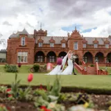 Happy Couple walking the grounds of Boclair House