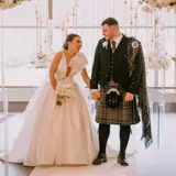 Happy couple walking up the aisle