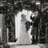 Couple drinking at the alter