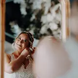 Bride getting ready in mirror