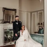 Couple posing for picture in Honeymoon Suite