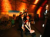 Team dressed as cowboys having photos taken