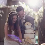 Couple cutting their wedding cake