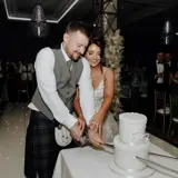 married couple cutting their wedding cake at boclair house