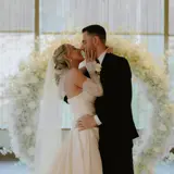 bride and groom lovingly holding one another during first dance