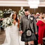 Couple walking down the aisle after being married