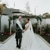 Couple looking back at camera after being married