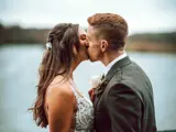 couple kissing at bowfield wedding venue johnstone
