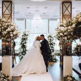 Couple kissing at the altar