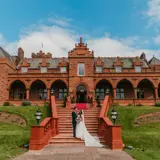 Couple on the stairs outside of Boclair House Hotel