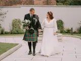 Couple walking infront of fountain