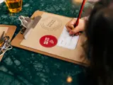 Child with activity book at Bird and Bell