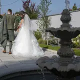 Couple standing infront of a fountain