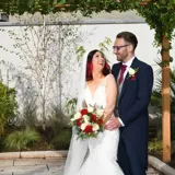 Couple hugging and smiling outside Redhurst