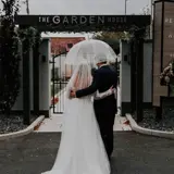 Couple under umbrella at The Garden House