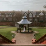 Far away shot of couple in band stand