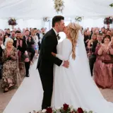 Couple kissing at the altar