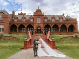 photoshoot of married couple in front of boclair house hotel & gardens