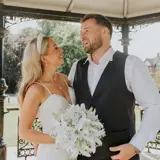 Wedding Couple Stand Under Outdoor Garden Pavilion at Glasgow wedding venue