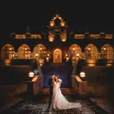 Couple kissing in front of Boclair House at night