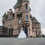 Couple standing infront of castle