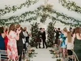 same sex couple kissing at the altar