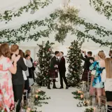 same sex couple kissing at the altar