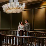 Couple sharing a moment on the stairwell at Boclair House Hotel