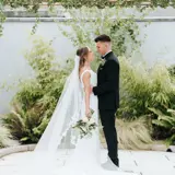 Couple looking lovingly at each other in the garden
