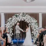 Couple tying the knot at the alter