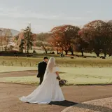 Couple walking the grounds after wedding