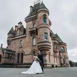 Couple standing infront of castle