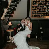 Couple in Honeymoon Suite kissing on chair