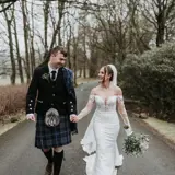 Couple walking down the road at Cornhill Castle