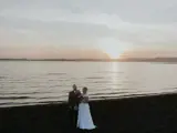 married couple on beach outside brisbane house wedding venue largs