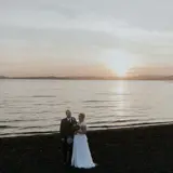 married couple on beach outside brisbane house wedding venue largs