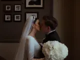 married couple kissing during wedding ceremony