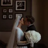married couple kissing during wedding ceremony