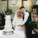 Couple cutting their cake