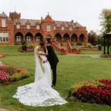 Couple sharing a kiss outside of Boclair House Hotel