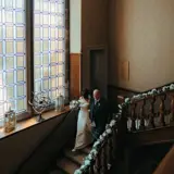 Couple walking downstairs at Cornhill Castle