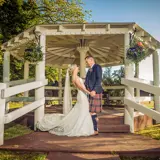 Couple standing infront of bandstand
